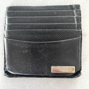 Bally Black Leather card holder. Fits 10 cards and bills in middle pocket. Used